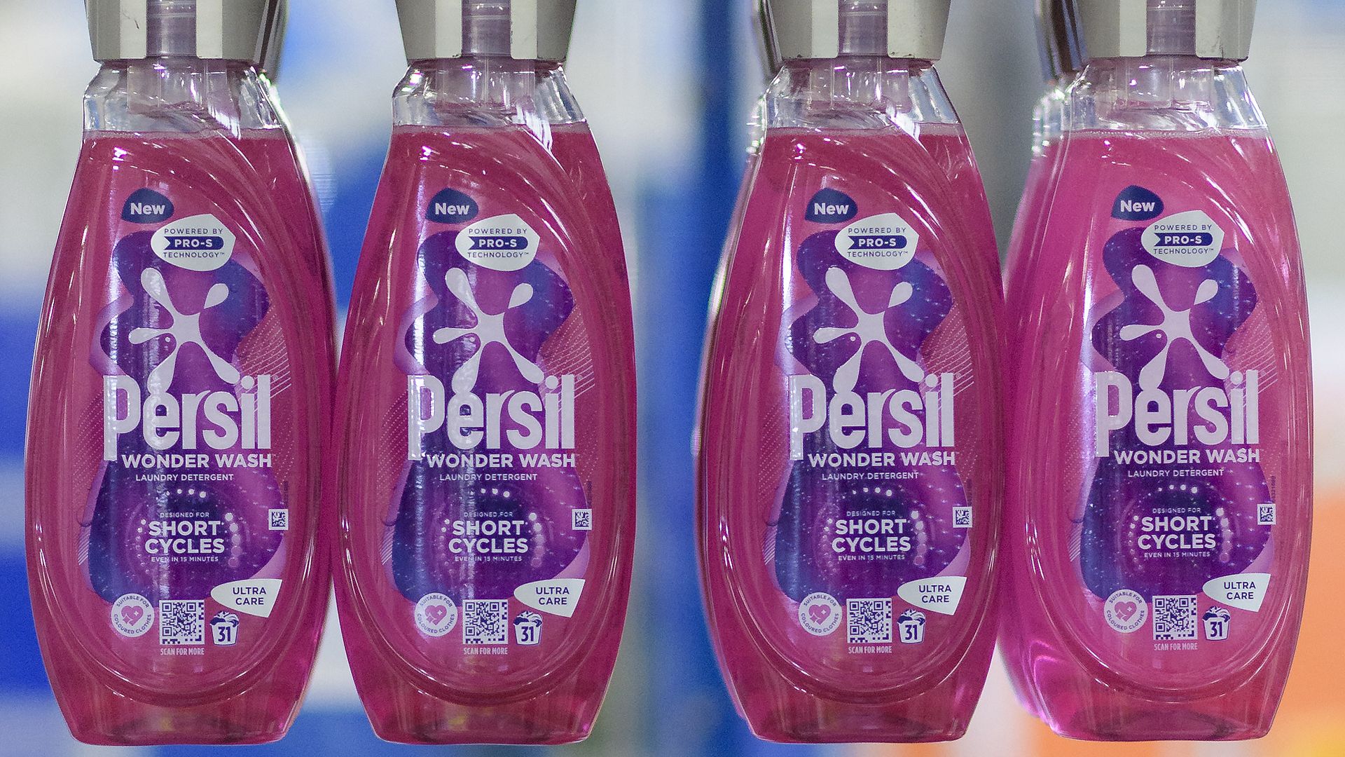 Four bottles of Persil Wonder Wash on a production line.