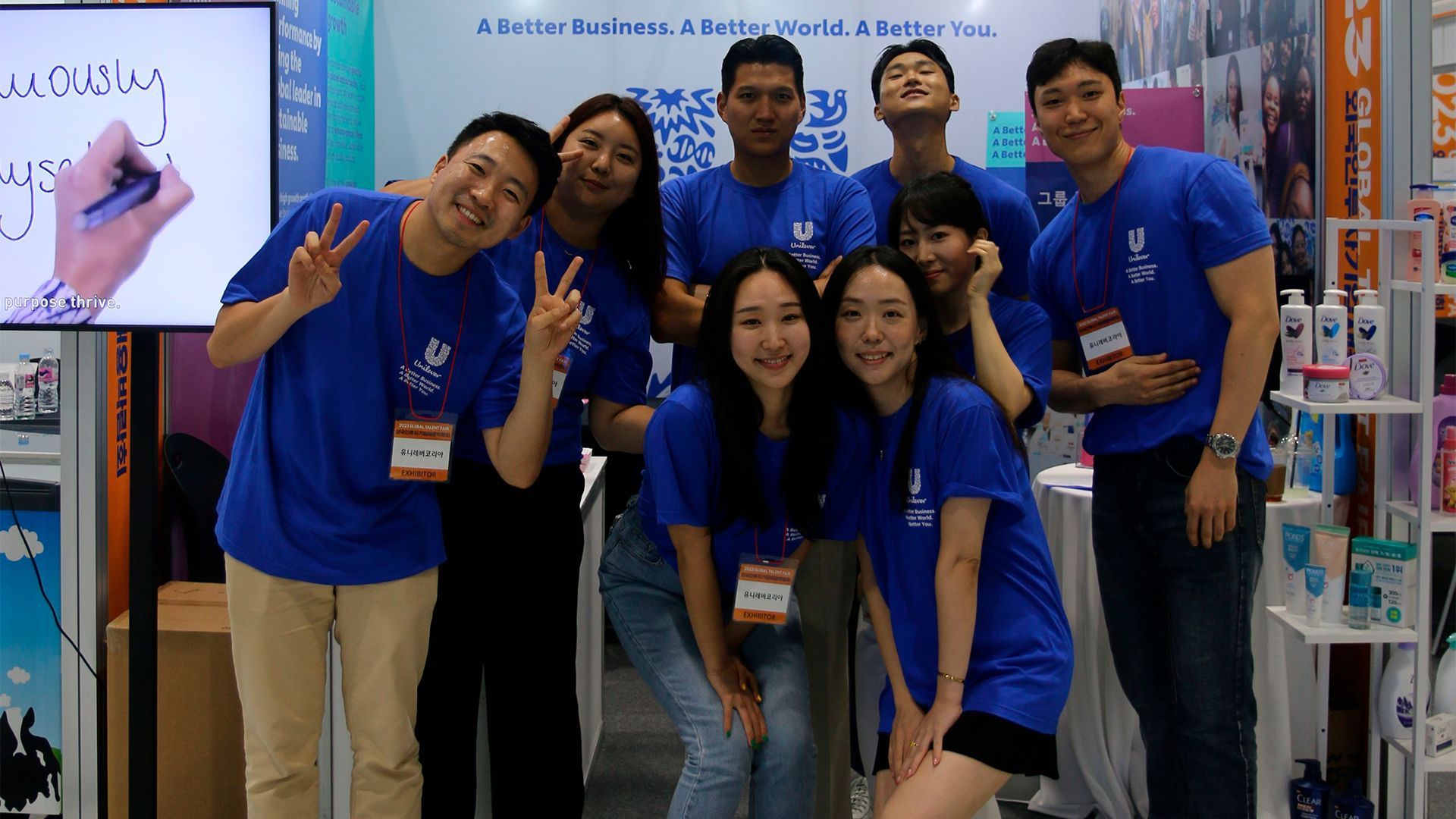 Unilever South Korea team members stand under a Unilever Korea banner