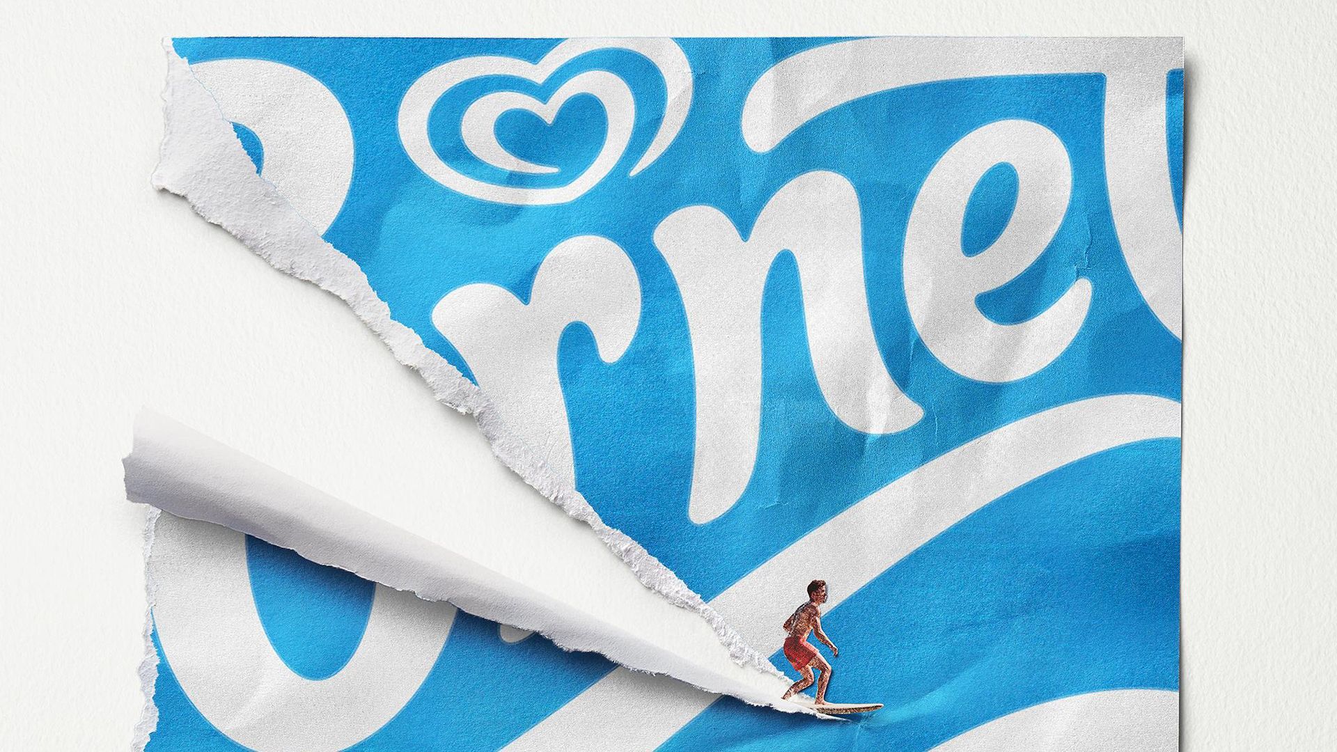 A campaign image of a surfer riding a Cornetto wrapper.