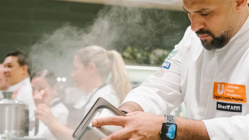 A Unilever Food Solutions chef cooking up one of the new Menu Trends recipes.