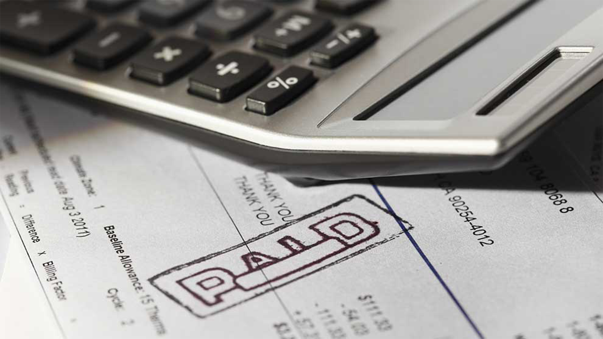 Calculator and paid invoice