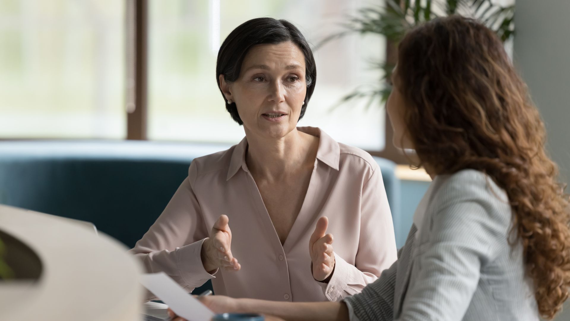 Two women having a serious conversation