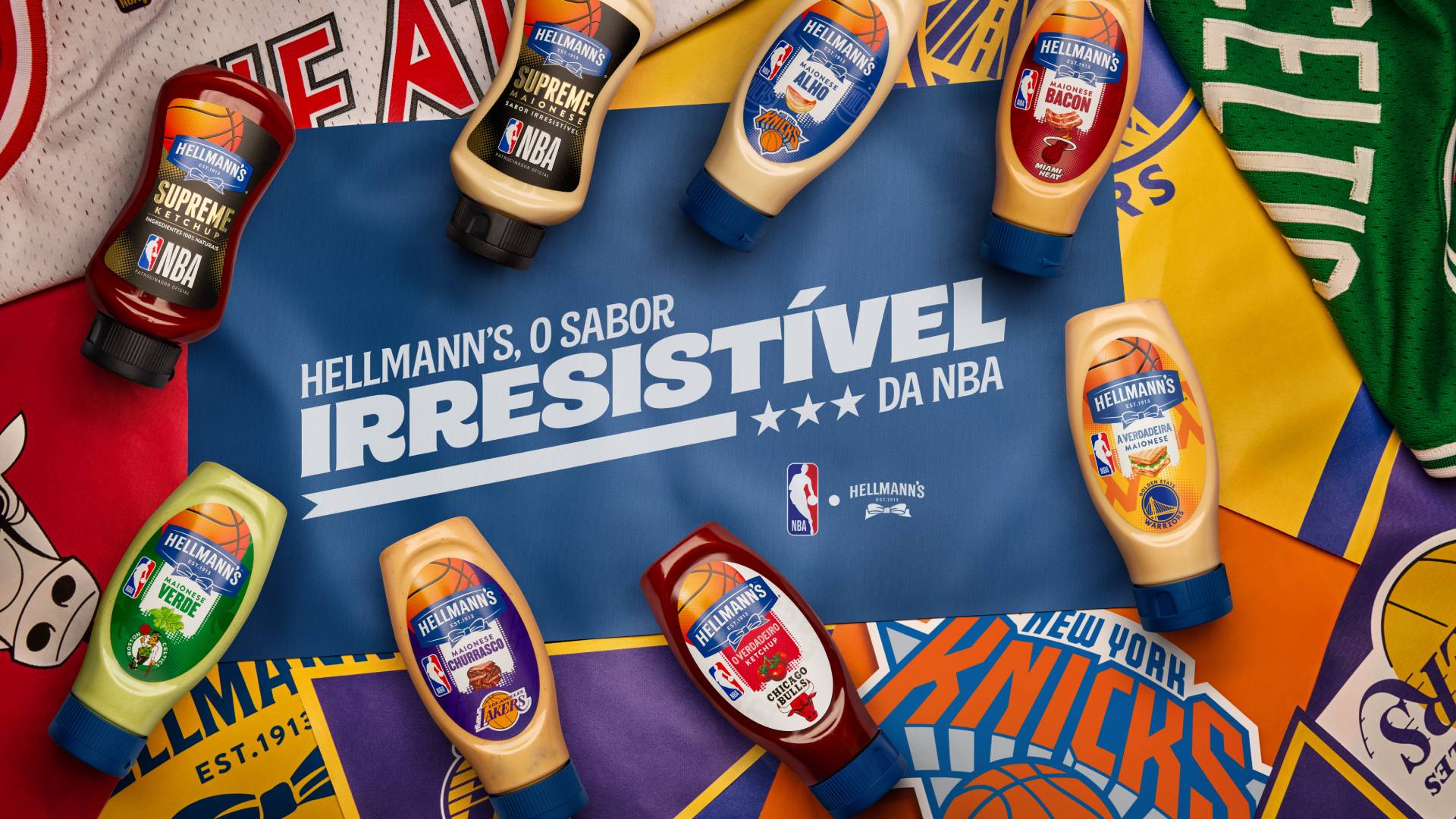 A selection of flavoured mayo squeeze bottles featuring NBA team logos are photographed against matching basketball shirts in celebration of Hellmann’s NBA collaboration