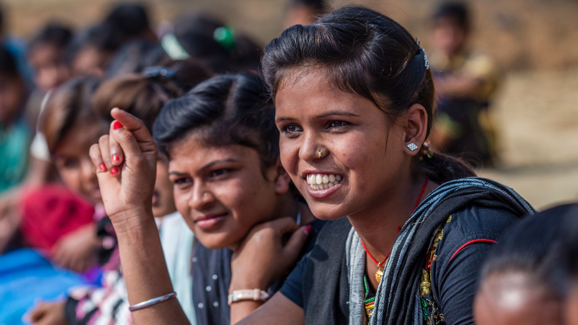 Close-up of two young women at an outdoor event
