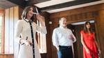 Noemie Lottiau, Global Fragrance Design Leader at Axe, sniffing scent sample cards. Two other people are blurred in the background.