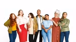 Seven women standing together side by side.