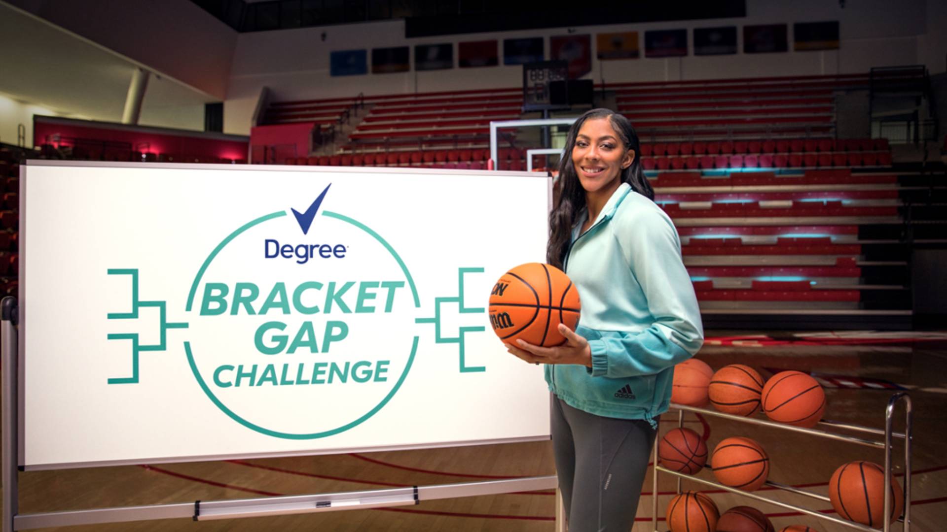 Basketball player Candace Parker at the Degree Bracket Gap Challenge launch event, holding an orange basketball. 