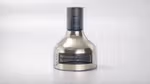Transparent bottle of Nexxus Promend Oil Resurrection for hair, displayed on a light background with a technical blueprint overlay.
