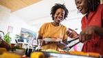 Two women cooking