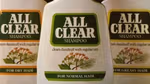 Three bottles of All Clear Shampoo, each designed for different hair types: Dry Hair, Normal Hair and Greasy Hair. The labels feature green branding with the text 'clears dandruff with regular use', along with an illustration of flowers and leaves on each bottle.