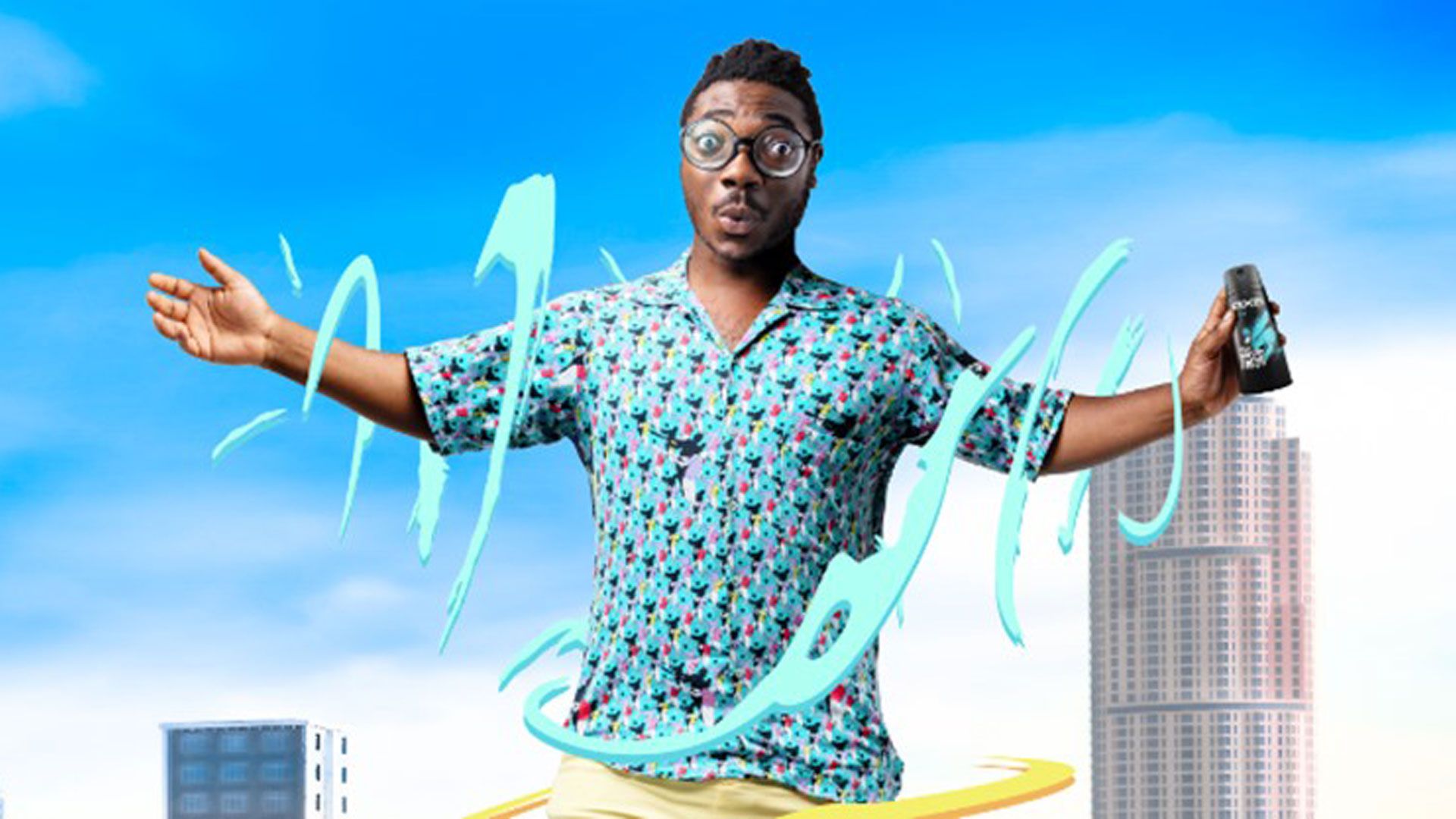 A photo from an Axe advertising campaign featuring a young Black guy with spectacles. Text reads ‘Smell irresistible all day”