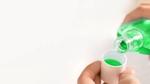 A photo of mouthwash in a glass