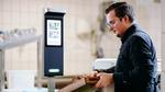 Man controlling food waste with technology