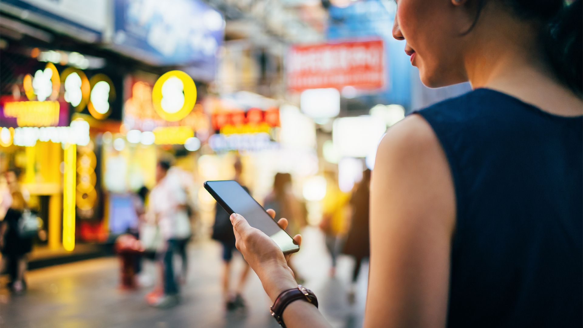 Woman on phone in Chinese market