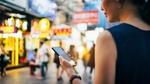 Woman on phone in Chinese market