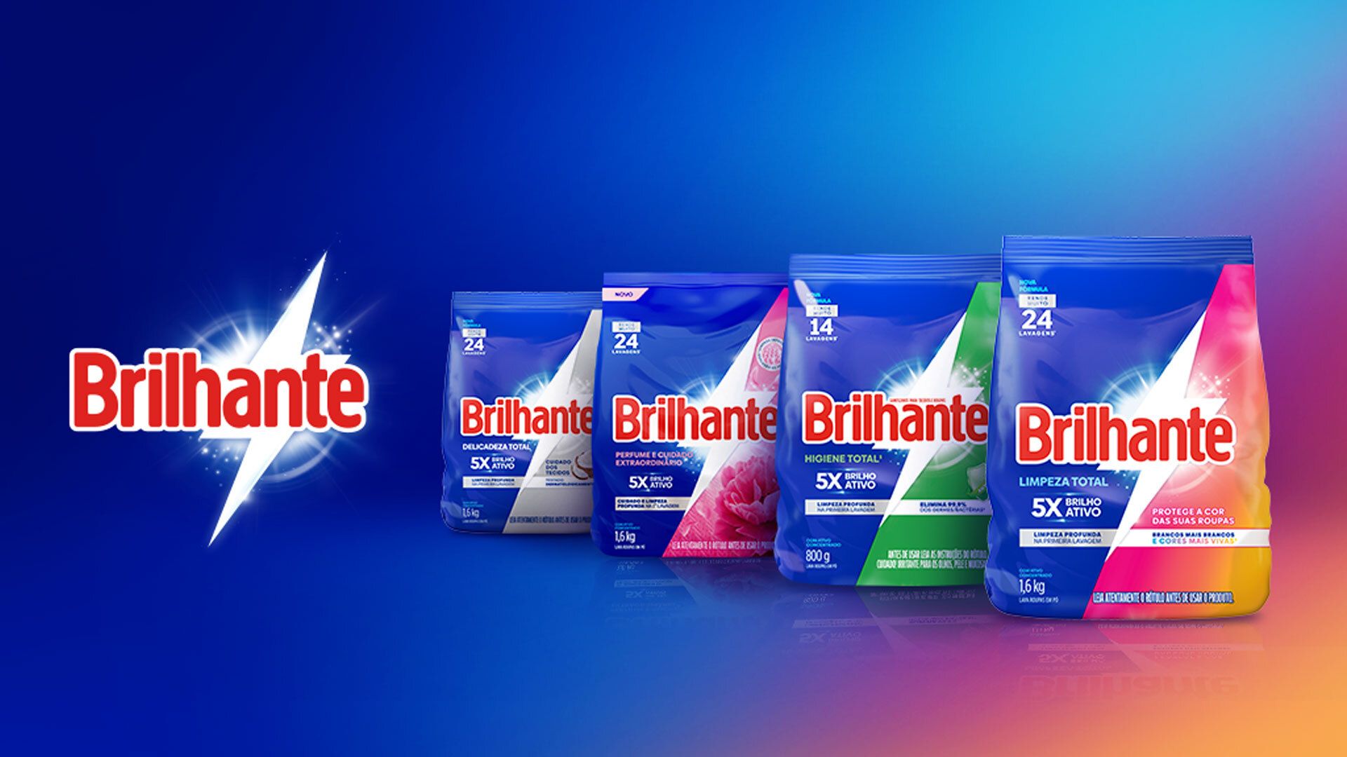 Four Brilhante laundry detergent packages displayed against a blue background. From left to right: green pack labelled ‘Higiene Total’, pink pack labelled ‘Limpeza Total’, purple pack labelled ‘Cuidado Total’, and white pack labelled ‘Delicadeza Total’. Each pack features bold red Brilhante branding and colourful accents.