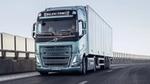 Blue metallic electric truck on a road