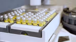 Clear glass chemical bottles containing Lnear alkylbenzene (LAB) made from renewable carbon