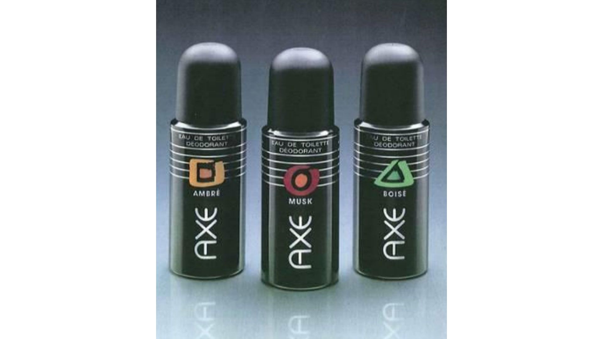 Three cans of Axe eau de toilette deodorant from the brand’s launch in France in 1983. Fragrances featured are Ambre, Musk and Boise. 