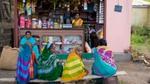 Five women in saris. A woman shopkeeper. Represents Unilever’s Shakti programme supporting rural entrepreneurship in India.
