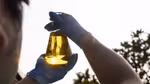 A glass container of biofuel, 40% of Unilever Port Sunlight’s fleet in the UK is powered by biofuel from cooking oil