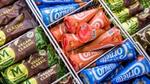 Overhead view of various Magnum and Cornetto ice creams in a freezer cabinet.