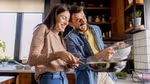 Couple smiling cooking