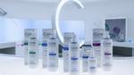 The full range of Clear’s ScalpCeutical’s bottles and packs on a white lab-style counter