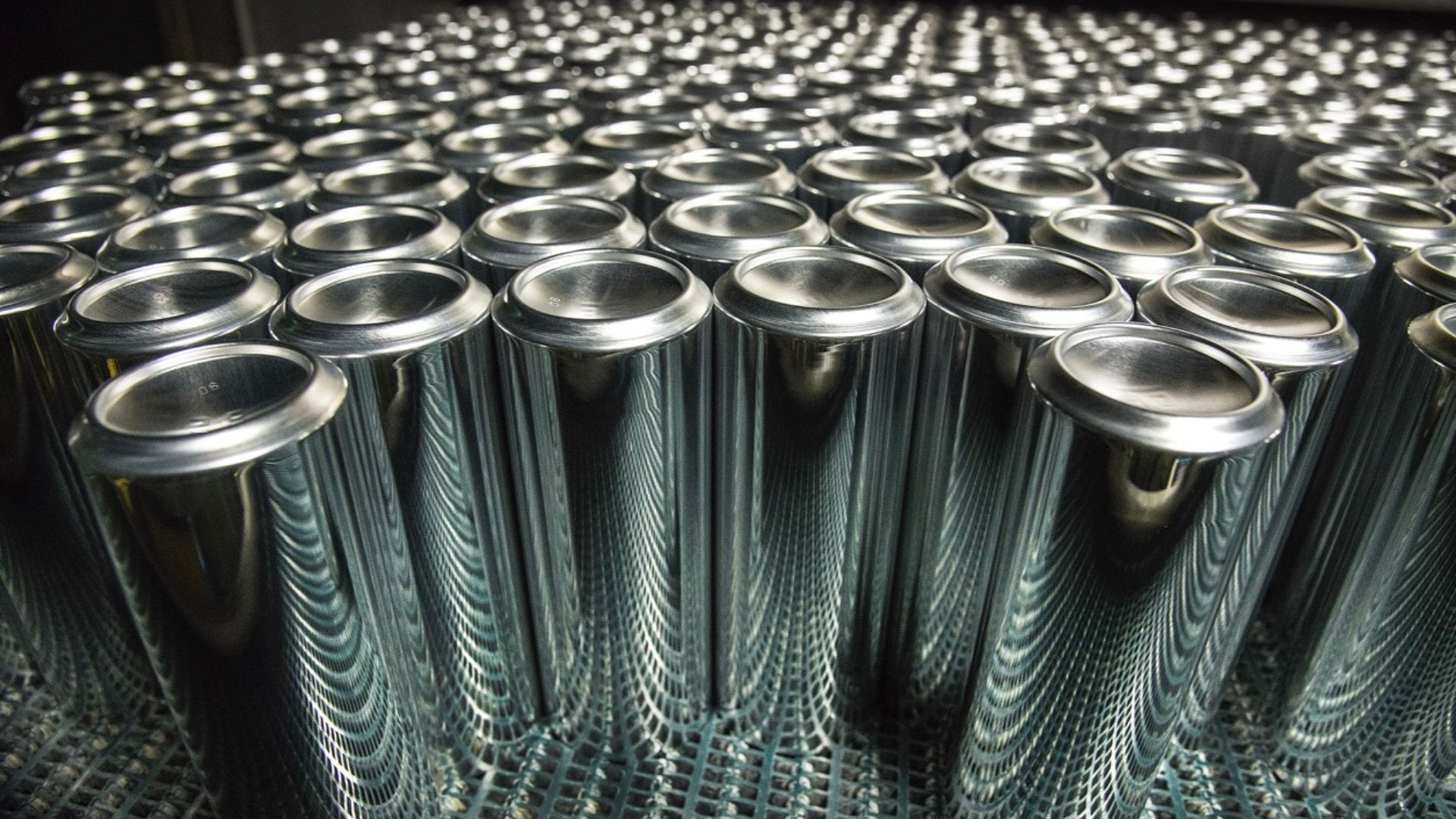 Aluminium cans are lined up ready to be supplied to Unilever for aerosols packaging.