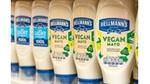 A selection of Hellmann’s products on a supermarket shelf.