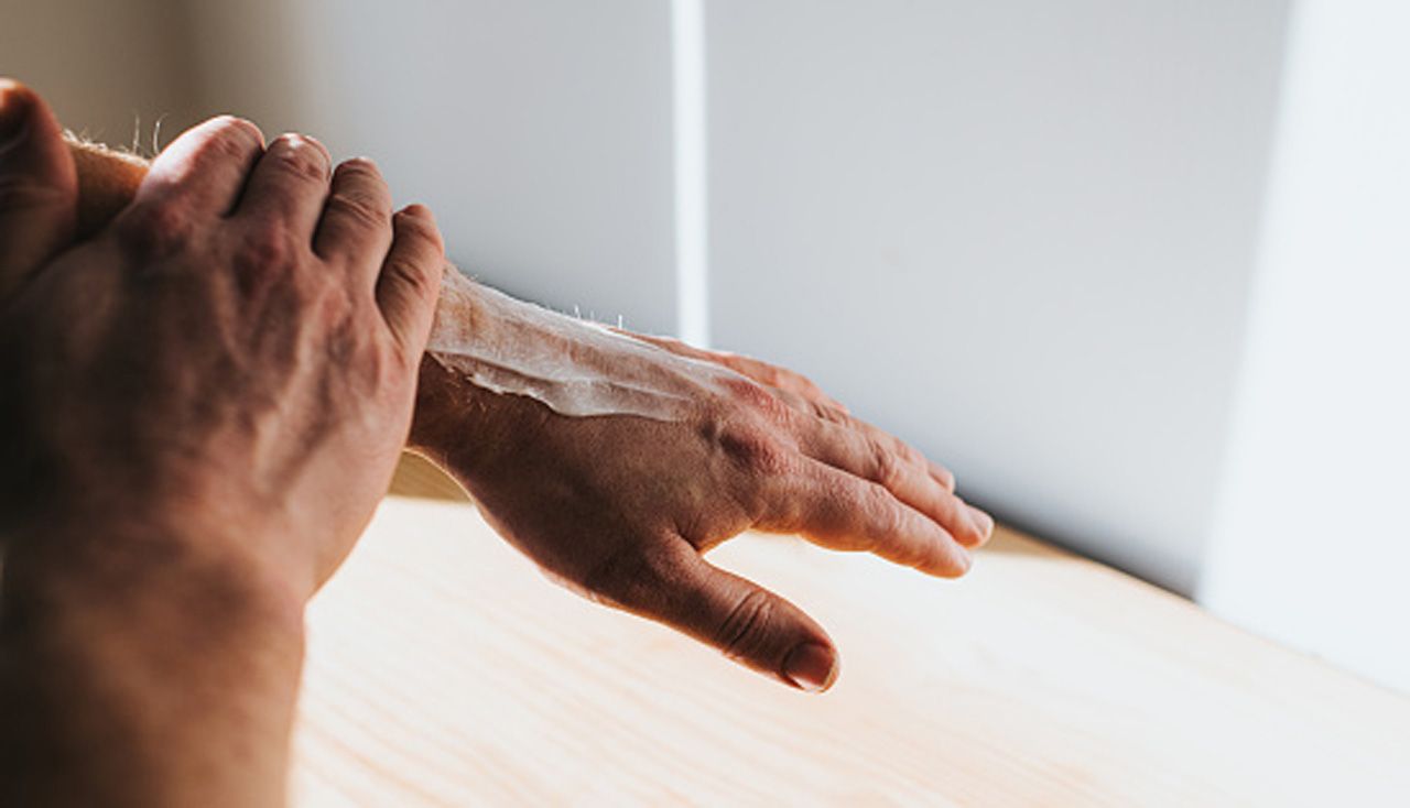 Wiping cream into hand