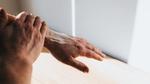 Wiping cream into hand