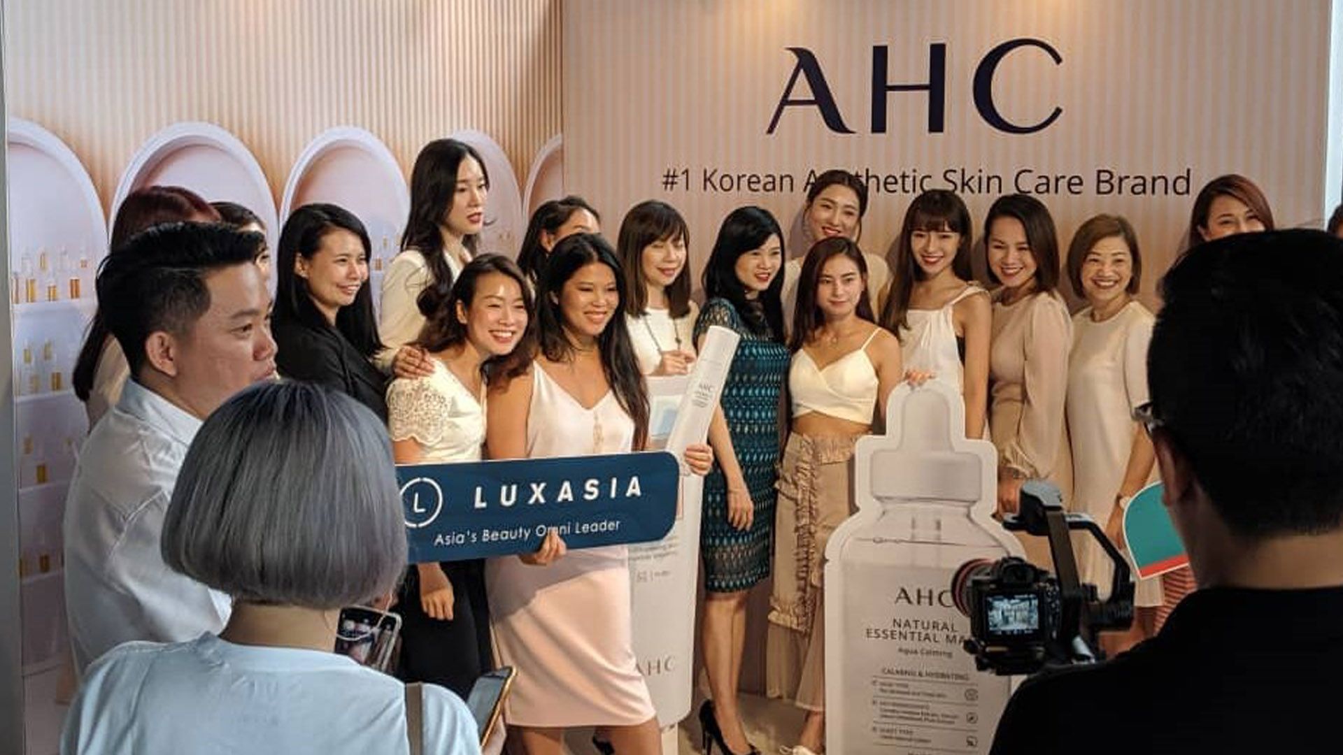 Group of women being photographed during the launch of Korean skincare brand AHC in Asia.