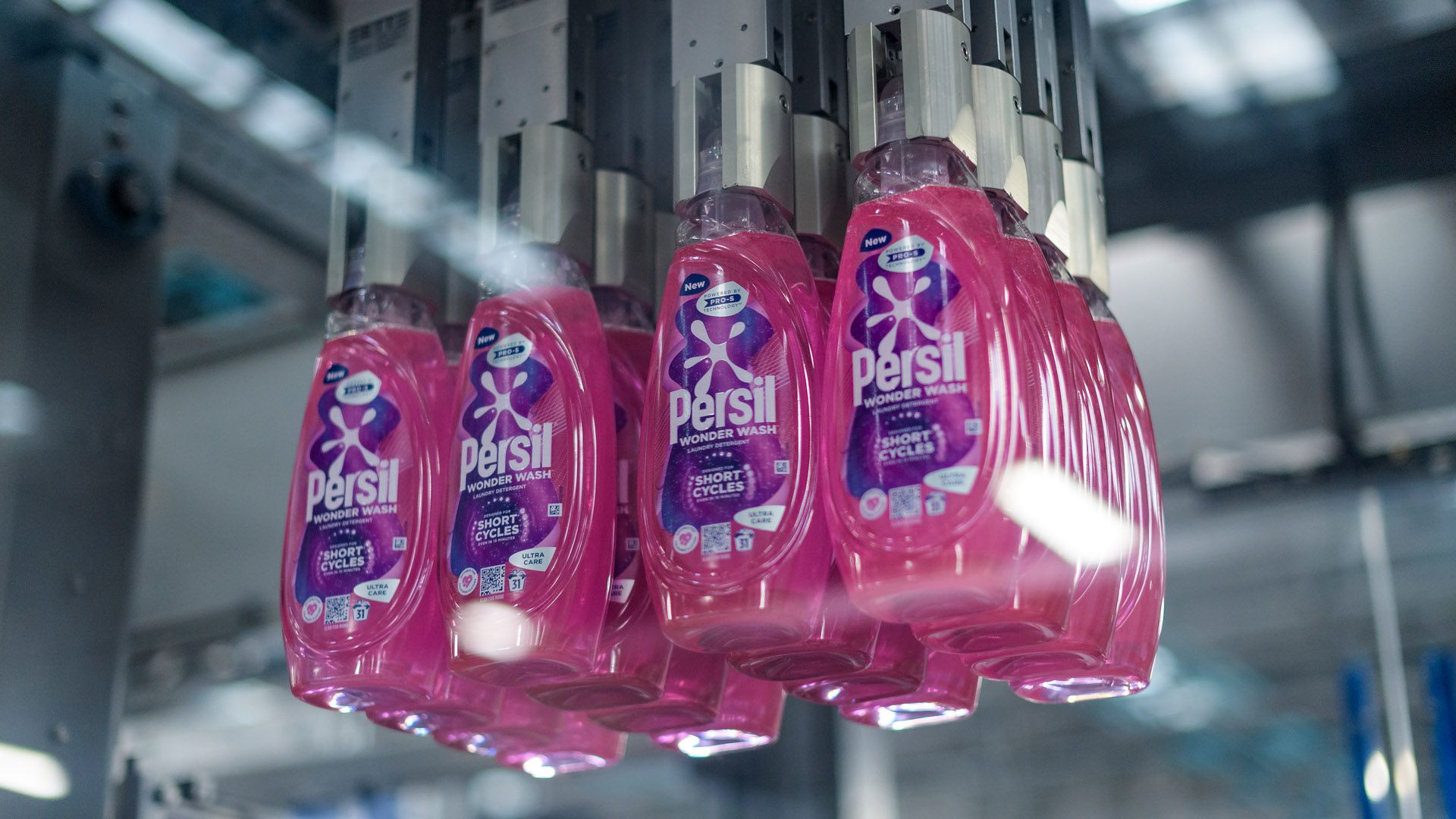 Bottles of Persil Wonder Wash on a Unilever factory production line.