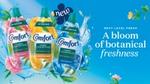 Advert for Comfort Botanicals showing three bottles and text that reads ‘A bloom of botanical freshness’.