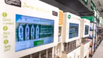 Three refill machines for Unilever brands lined up in the aisle of the Asda store in Leeds, UK.