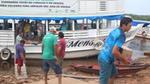 Boxes being unloaded from a riverboat