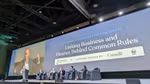 Five panellists seated on a stage under a large screen displaying the title 'Key priorities for an effective treaty: uniting business and finance behind common rules'. Unilever CEO Hein Schumacher is addressing the audience.