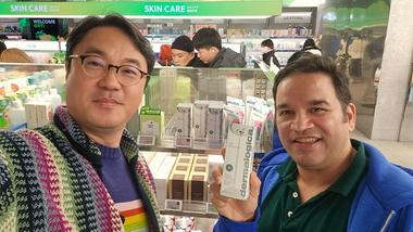 Unilever International CEO Aseem Puri in a customer store holding a Dermalogica product during a market visit to South Korea.
