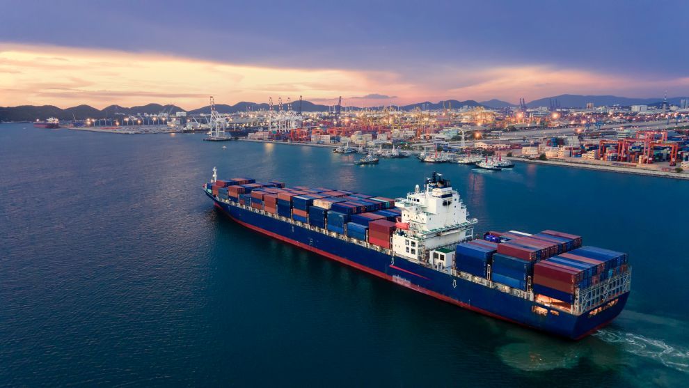 Aerial view of a container ship about to dock at the Port of Thailand