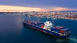 Aerial view of a container ship about to dock at the Port of Thailand