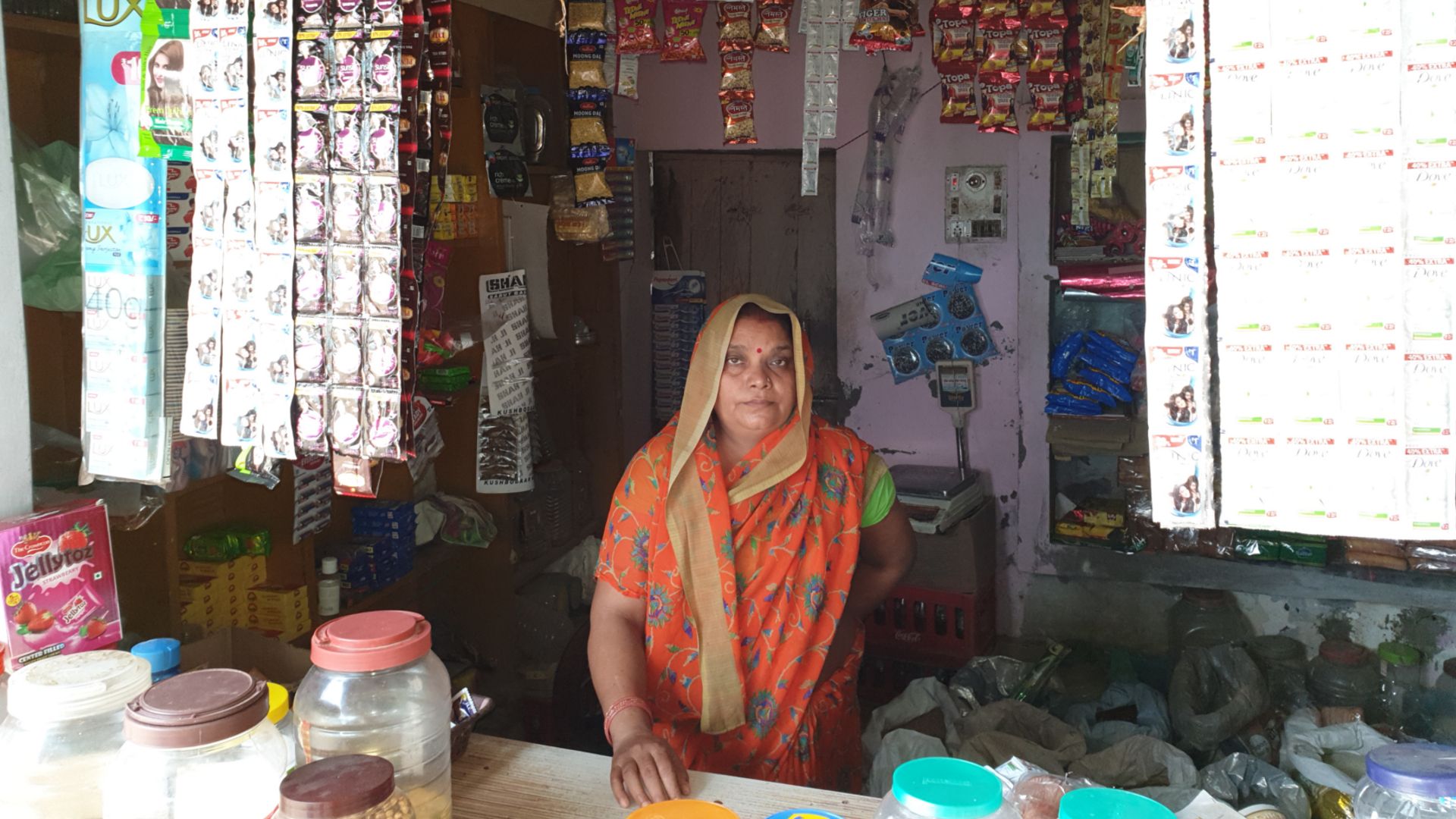 A person part of the Shakti programme in their shop selling Unilever brands such as Lux and sunsilk.