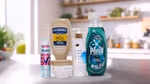 A variety of Unilever's Power Brands arranged on a kitchen counter. From left to right, you can see a jar of Knorr chicken bouillon, a Degree deodorant spray labelled "WHOLE BODY DEO", a box of Magnum ice cream labelled "UTOPIA", a bottle of Dove body lotion pro-ceramides serum, a jar of Dove Intensive Repair cream and a bottle of Persil Wonder Wash. In the background, there's a modern kitchen with plants and various items on the shelves.