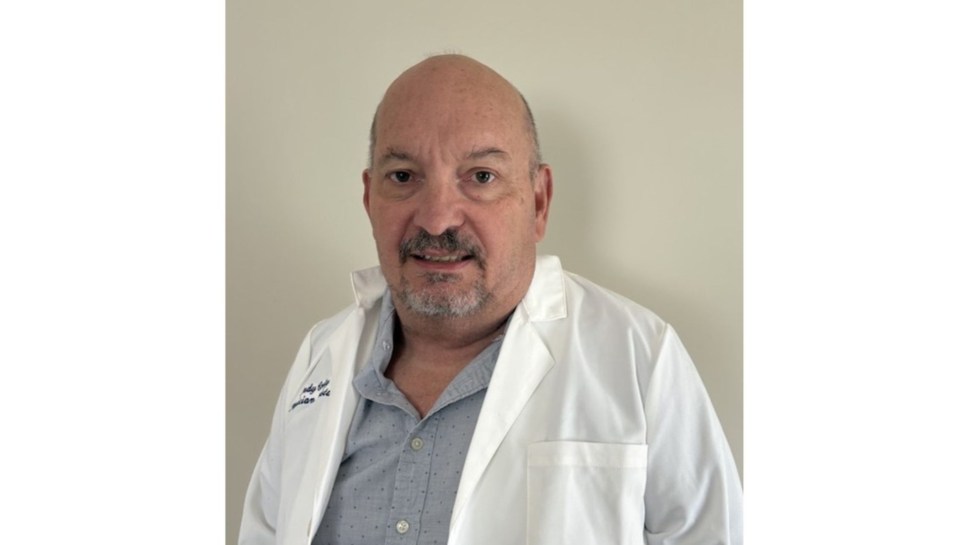 A photo of a scientist who worked on the Vaseline Verified campaign. A white man with short hair and a beard.