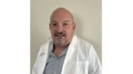 A photo of a scientist who worked on the Vaseline Verified campaign. A white man with short hair and a beard.