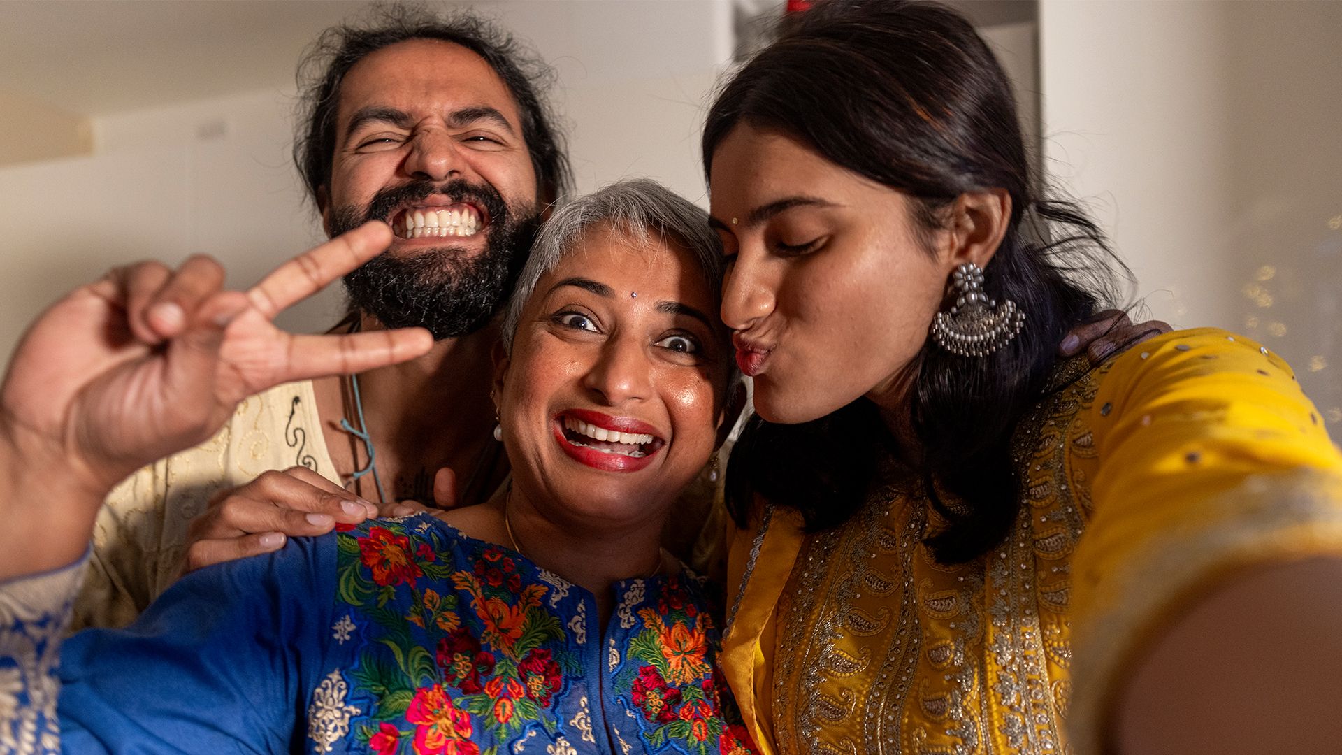 Three people of same family smiling