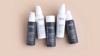 A photo of products from the Paula’s Choice AHA Exfoliant and BHA Exfoliant range. Packaging is white and dark grey.