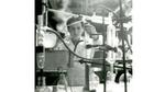 A young girl using science equipment