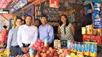 Group of people standing at a market stall for the launch of Horlicks in Nepal.