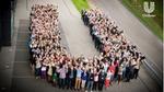 A group of Unilever employees forming the letter U